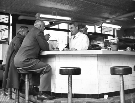 Jimmy serves Liberty Cafe customers at counter stools